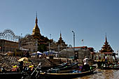 Inle Lake Myanmar. Phaung Daw Oo Paya. Enshrined in the pagoda are five small ancient Buddha images that have been transformed into amorphous blobs by the sheer volume of gold leaf applied by devotees.  